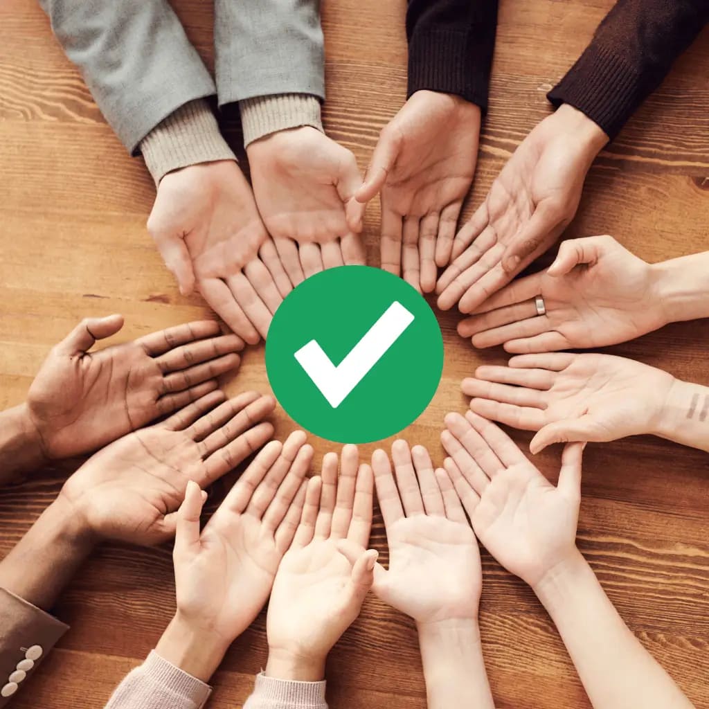 An image of a diverse group of people's hands holding the Google Guaranteed check mark