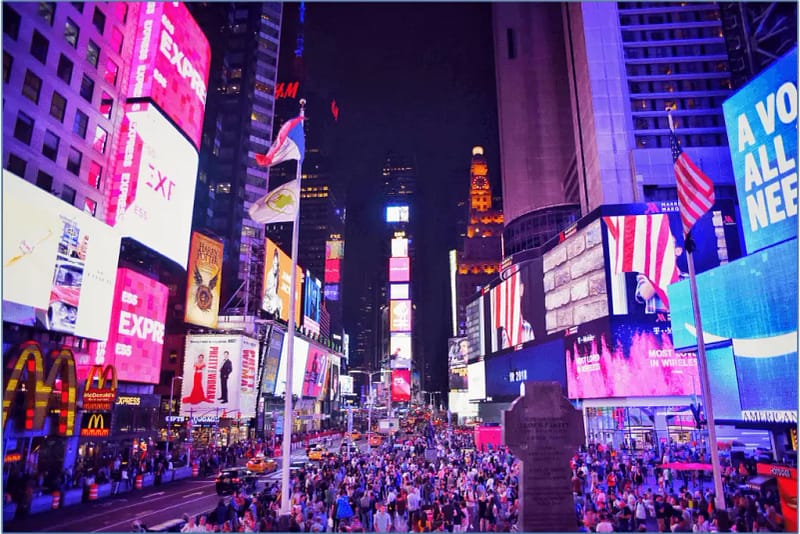 An image of Times Square lit up with digital advertising for social media ads and PPC ads