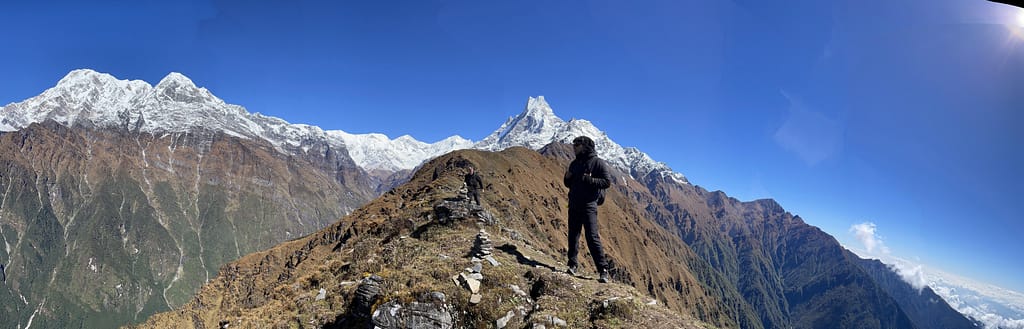 Sherpa traversing mountain ridge